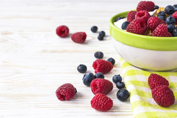 Healthy corn flakes breakfast on the white wooden table