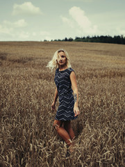 young beautiful girl in autumn field