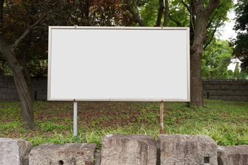 Large blank billboard on a street wall, banners with room to add your own text