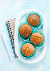 Delicious muffins on a blue background