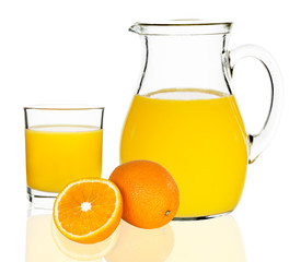 orange juice in a glass and carafe