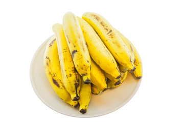 Ripe bananas on plate isolated on white background