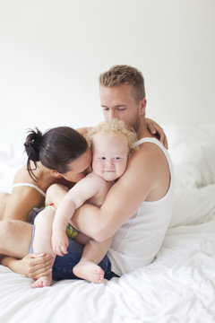 Family playing in bed, Vaxjo, Smaland, Sweden
