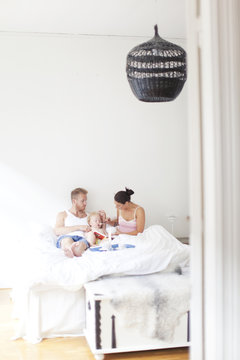 Family breakfast in bed, Vaxjo, Smaland, Sweden