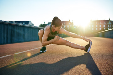 Sun highlights young muscular female athlete