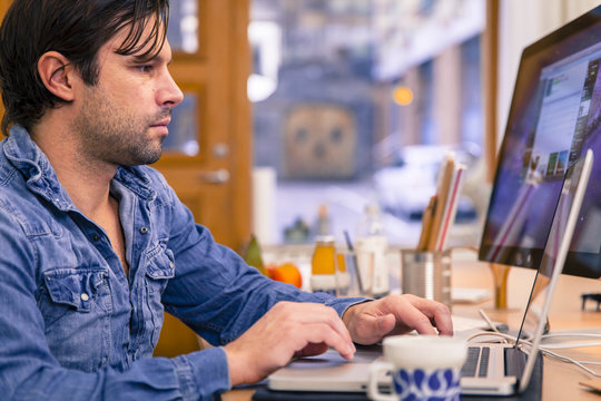 Mid adult man working in office, Gothenburg, Sweden