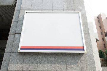 Fototapeta premium Large blank billboard on a street wall, banners with room to add your own text