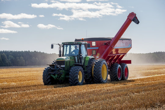Fototapeta Combine harvester on field, Sweden
