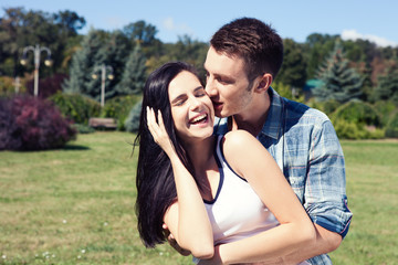 Fototapeta premium Portrait of happy young couple looking at each other.