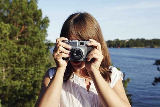 Young woman with camera, Sweden