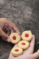 Strawberry biscuits is delicious on wood background.