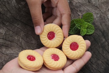 Strawberry biscuits is delicious on wood background.
