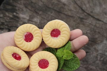 Strawberry biscuits is delicious on wood background.