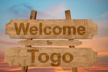 Welcome to Togo sing on wood background
