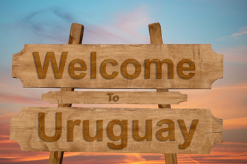 Welcome to Uruguay sing on wood background