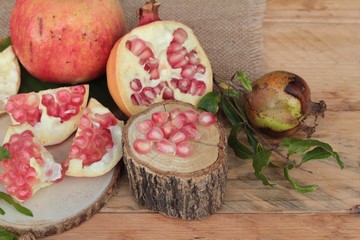 Ripe pomegranate fruit delicious on wood background.