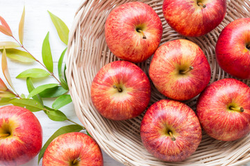 Red apple on rustic wooden table background