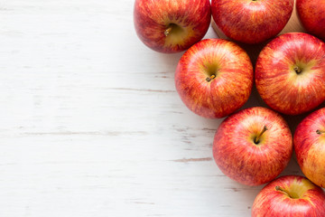 Red apple on rustic wooden table background