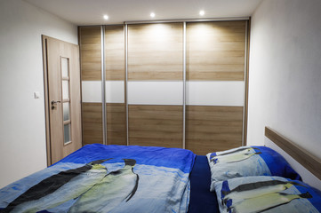 Fototapeta na wymiar Wooden cabinet in bedroom