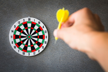 Target aim, symbol of goal and objective over gray grunge background, business concept
