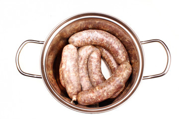 Raw meat sausages isolated