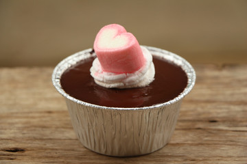 Chocolate cupcake on wood.