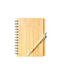Closeup surface front of cover brown wooden note book with brown pen isolated on white background