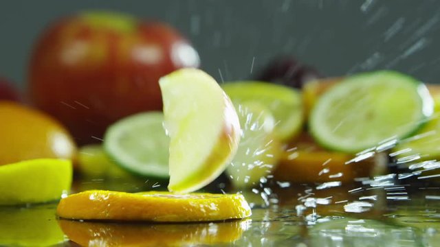 slices of oranges, apple, limes and lemons