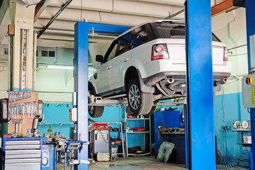 Moscow, Russia - August, 26, 2016: Car on a lift in a car repair station in Moscow, Russia