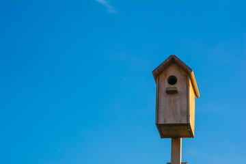 Nesting box on blue sky background