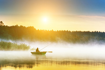 man fishes in the lakes of the Mazury