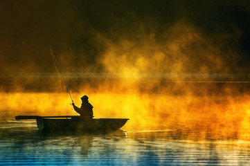 man fishes in the lakes of the Mazury - obrazy, fototapety, plakaty