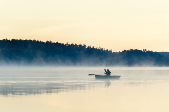 man fishes in the lakes of the Mazury