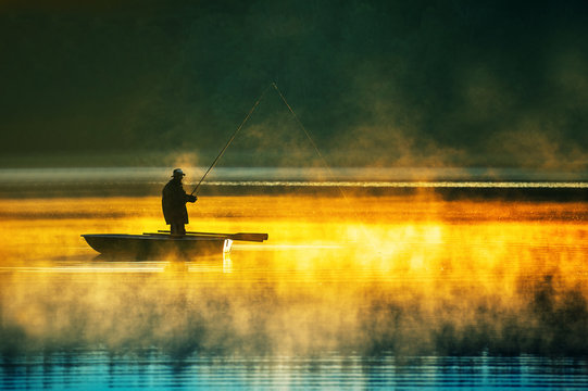 man fishes in the lakes of the Mazury © pershing