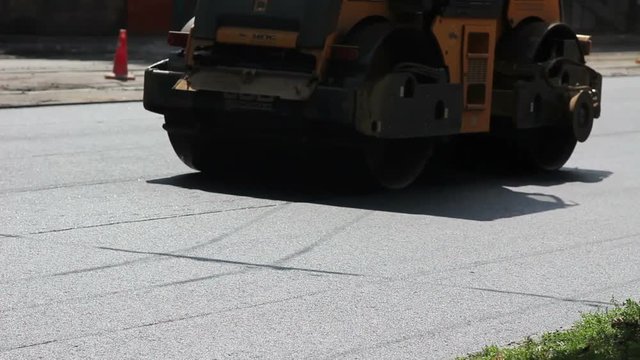 side view road roller compact asphalt