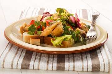 smoked scottish mackerel salad with tomato and chopped onion on