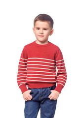 Boy in autumn clothes posing on white background.