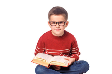 Child student with a book isolated over white background.