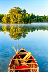 Old Canoe on a tranquil Lake.