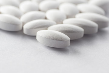 Fototapeta na wymiar Multiple pills depicting medical treatment or pahrmaceutical ind
