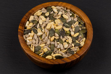mixed seeds in wooden bowl