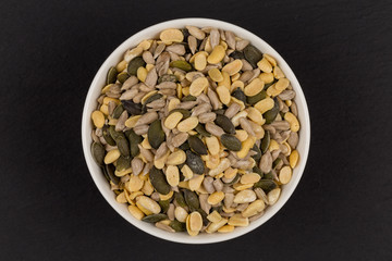 mixed seeds in wooden bowl