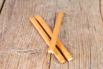bread sticks grissini on wooden background