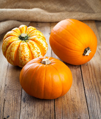 pumpkins on wooden board