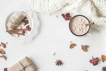 Autumn. Hot chocolate, knitted blanket, gift, dried flowers and leaves. Flat lay, top view