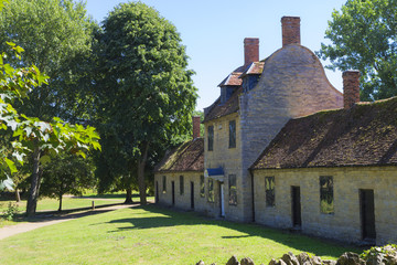 Great Linford manor complex under blue sky