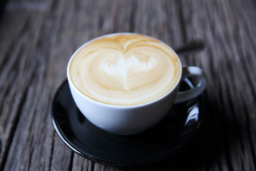 cappuccino coffee on wood background