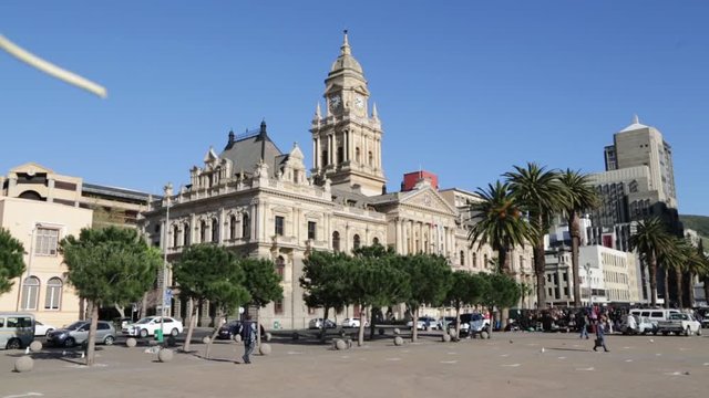   unidentified people and town hall  in the square of cape town south africa   .