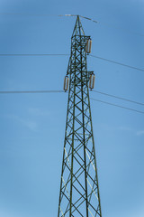 Pylon and transmission power line in bright day