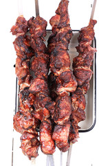 barbecue skewers on a white wooden background top view top view shallow depth of field